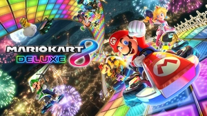 Mario Kart 8 Deluxe artwork featuring various Nintendo characters racing on Rainbow Road